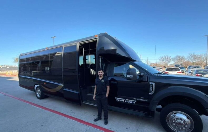 JC Limo driver standing beside luxury motor coach in Dallas providing professional group transportation service