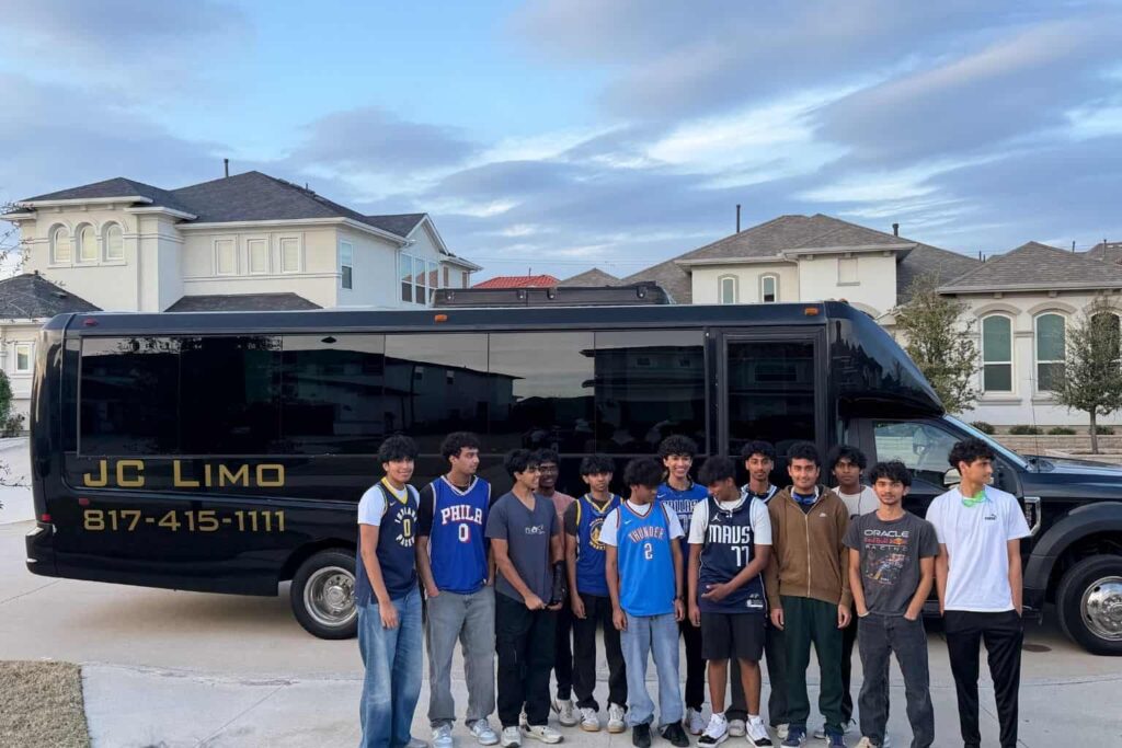 Student group standing in front of JC Limo shuttle bus in Dallas for school and youth transportation services